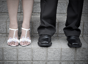 A couples' shoes atop steps of stone