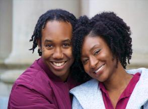 A couple poses for a photograph.